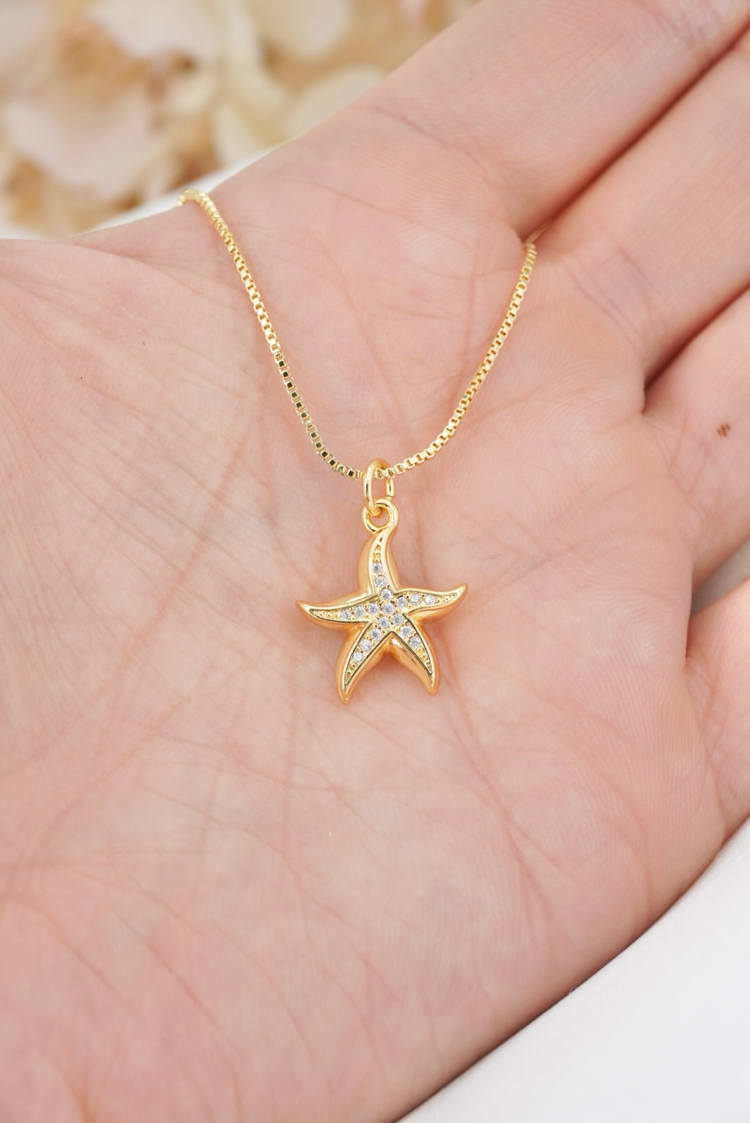 ESTRELLA DE MAR CON ZIRCONES