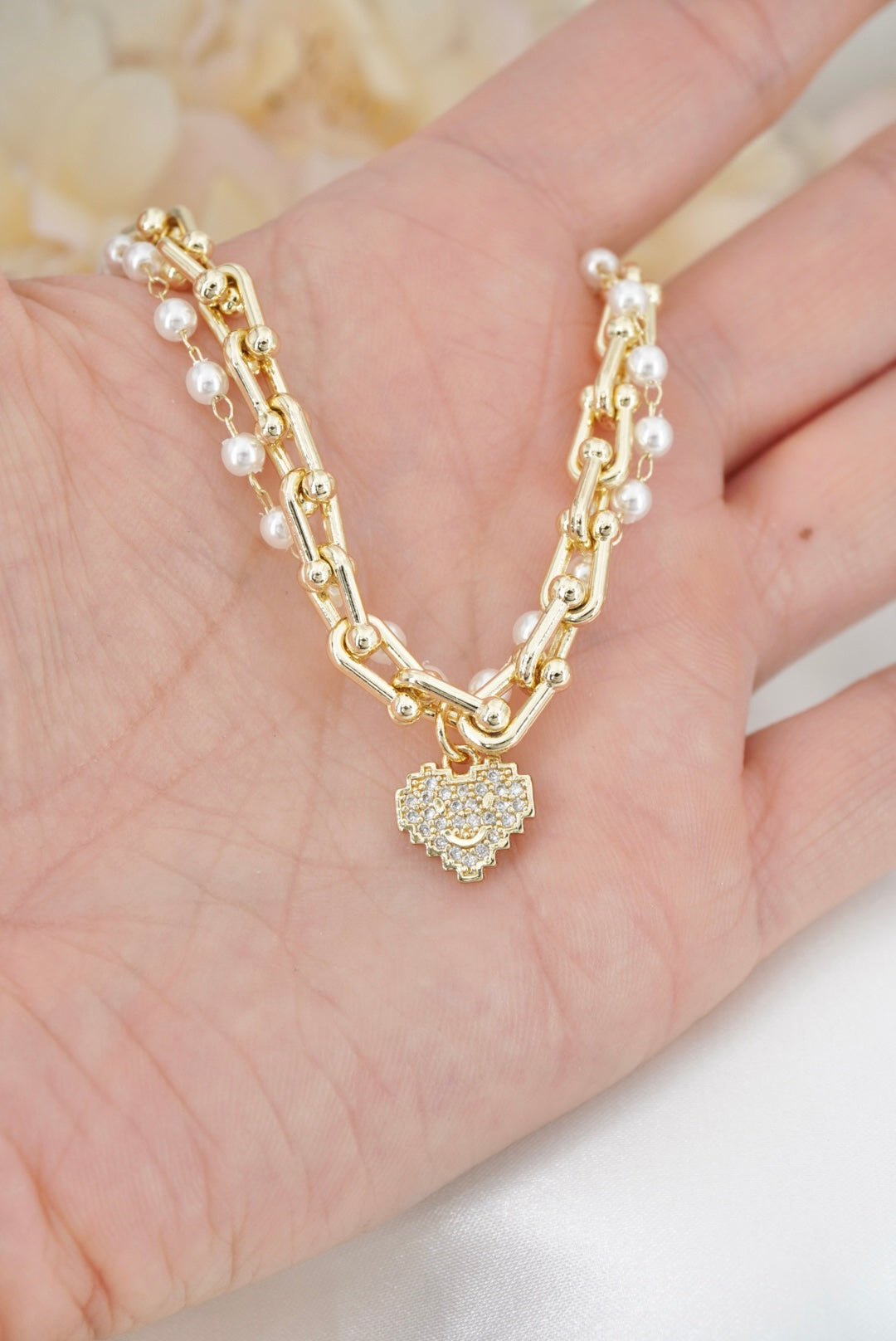 PULSERA DOBLE CON PERLAS Y CORAZON