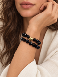 PULSERA NEGRA CON CORAZON DORADO ELASTICA